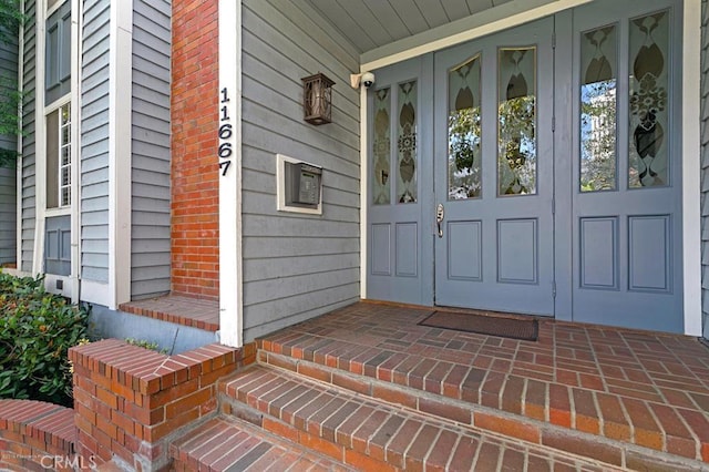 doorway to property with french doors and covered porch