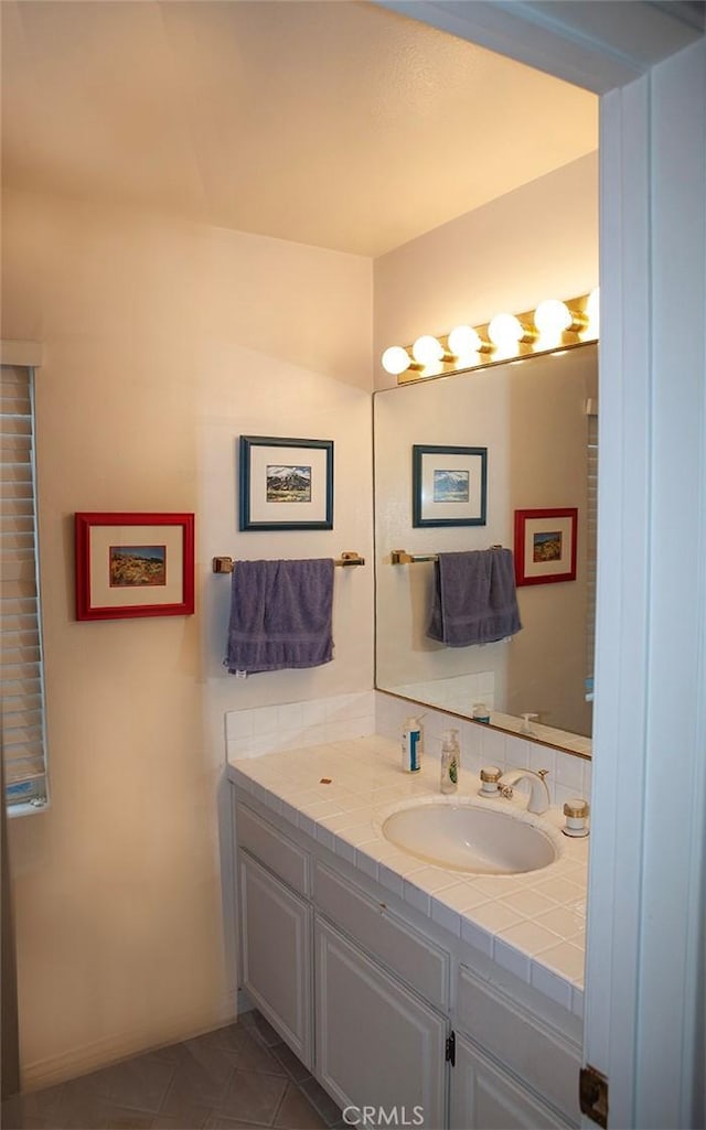 bathroom featuring tile patterned floors and vanity