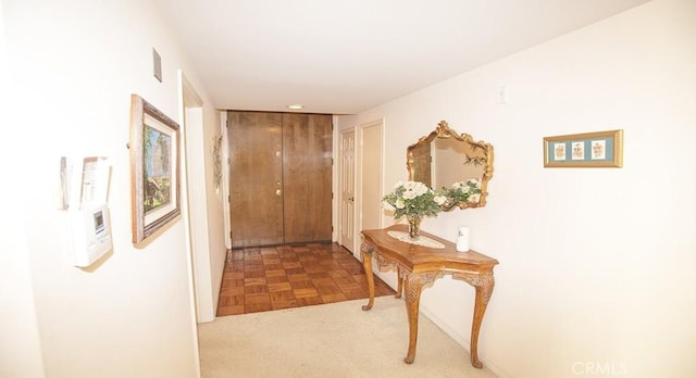 hallway with parquet flooring