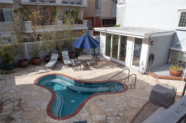 view of swimming pool featuring a fenced in pool and a patio area