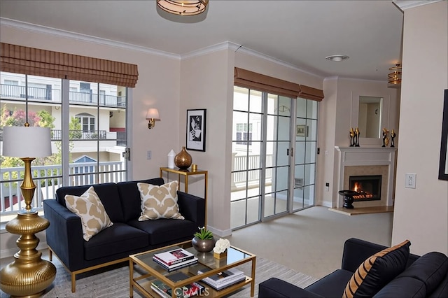 living room with baseboards, ornamental molding, carpet, and a warm lit fireplace