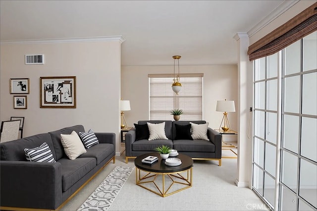 living area with crown molding, baseboards, and visible vents