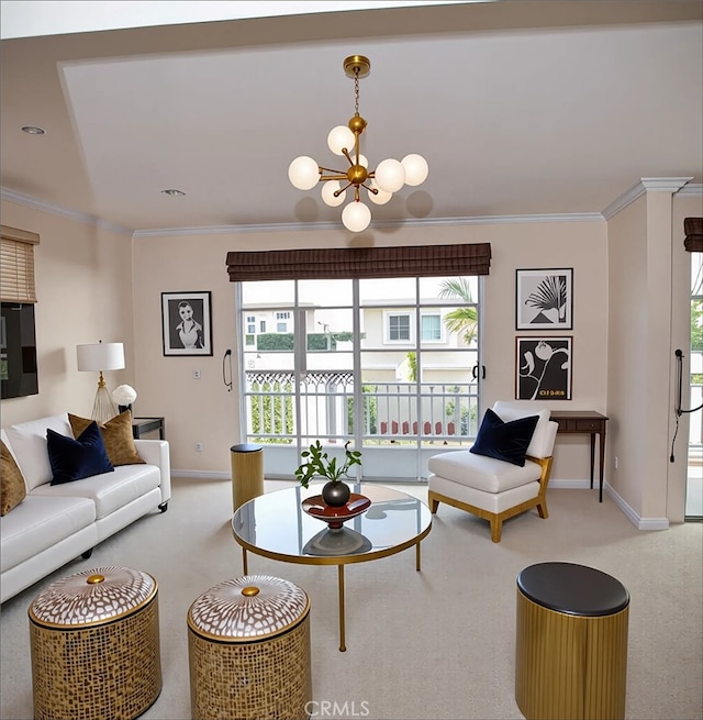 carpeted living area featuring plenty of natural light, baseboards, ornamental molding, and a notable chandelier