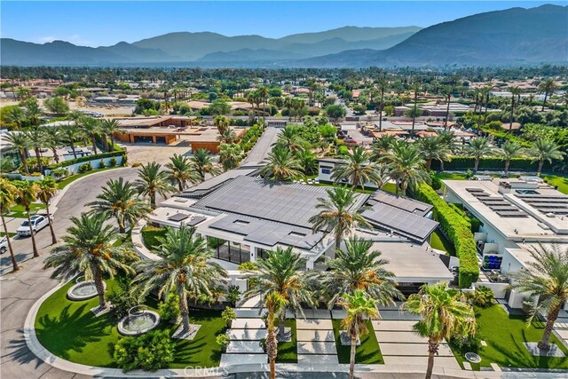 birds eye view of property with a mountain view