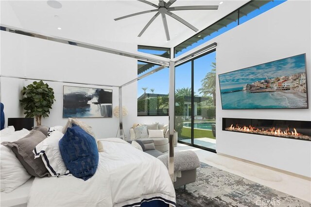 bedroom featuring access to outside and ceiling fan