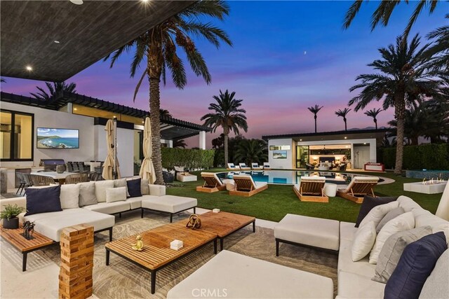 view of patio featuring outdoor lounge area and exterior kitchen