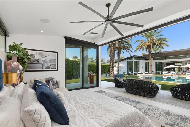 bedroom featuring ceiling fan, a wall of windows, and access to outside