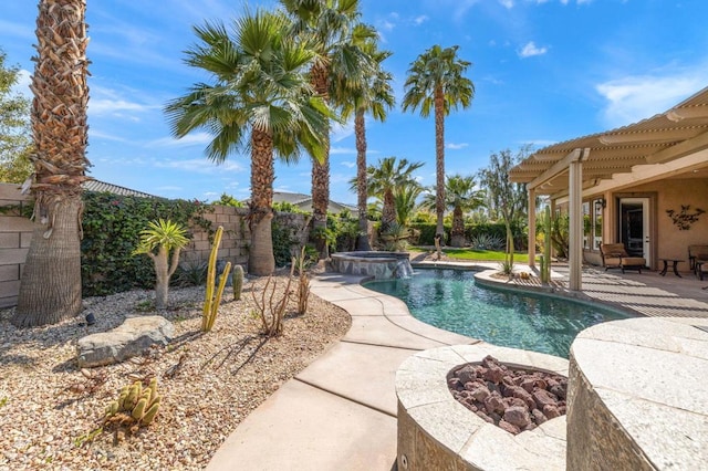 view of swimming pool with a pergola, a fire pit, a patio, and an in ground hot tub