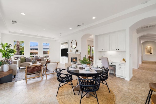 dining space featuring light tile patterned floors