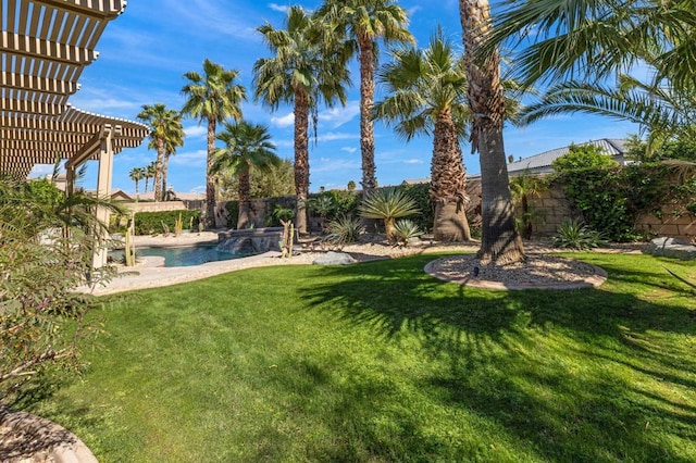 view of yard with a fenced in pool and a pergola