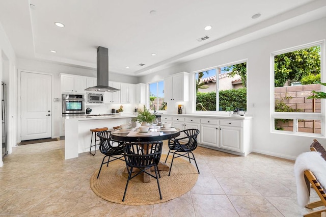 dining space featuring light tile patterned floors