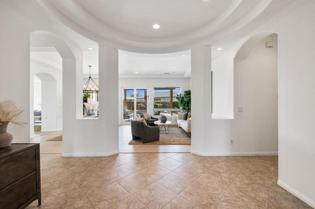 entrance foyer featuring an inviting chandelier