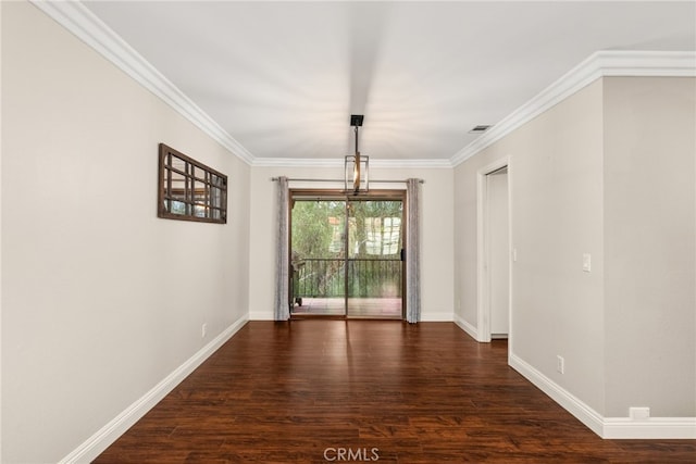 unfurnished dining area featuring dark hardwood / wood-style floors, crown molding, and an inviting chandelier