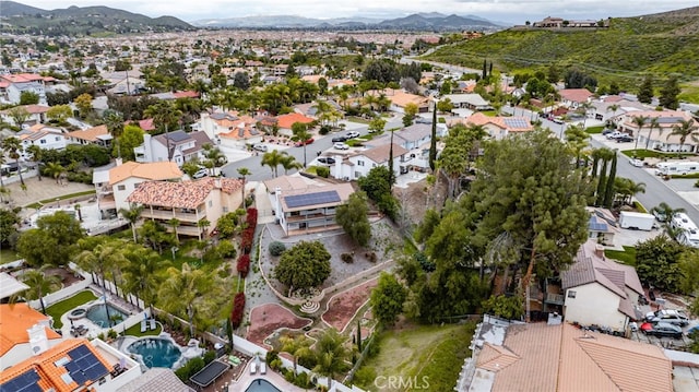 birds eye view of property with a mountain view