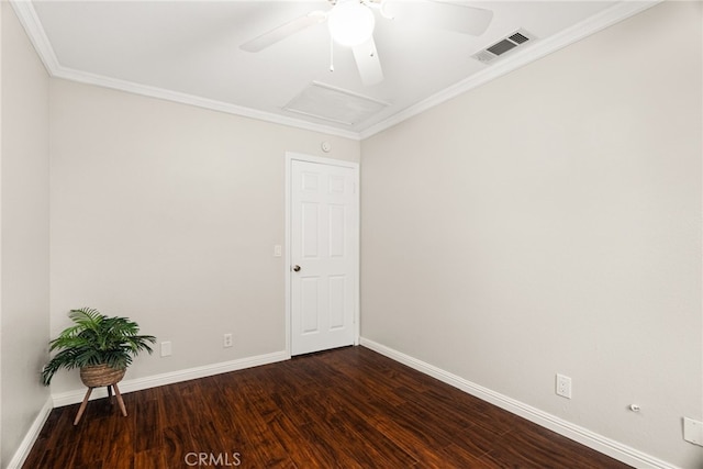 spare room with dark wood-type flooring, ceiling fan, and ornamental molding