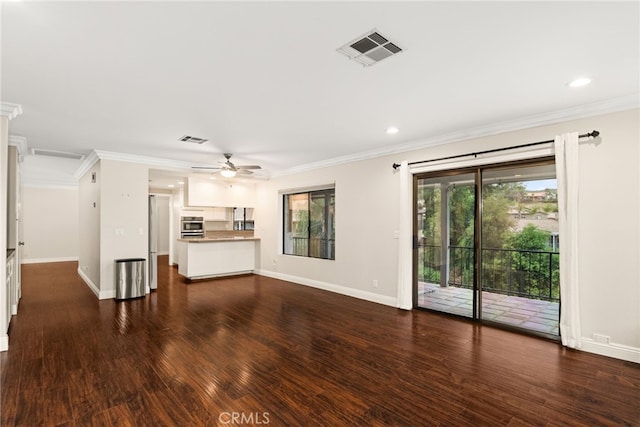 unfurnished living room with ceiling fan, crown molding, and dark wood-type flooring