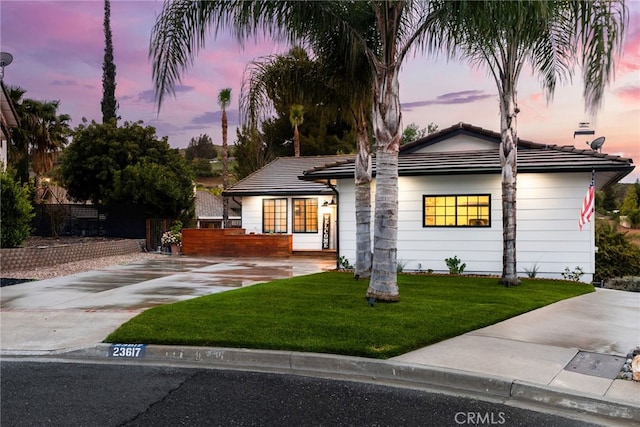 view of front of property with a lawn