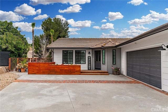 ranch-style home featuring a garage