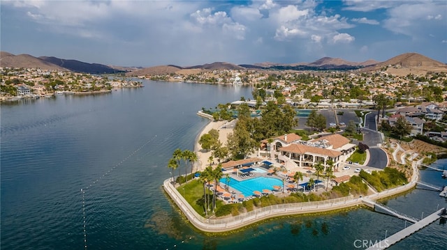 birds eye view of property featuring a water and mountain view