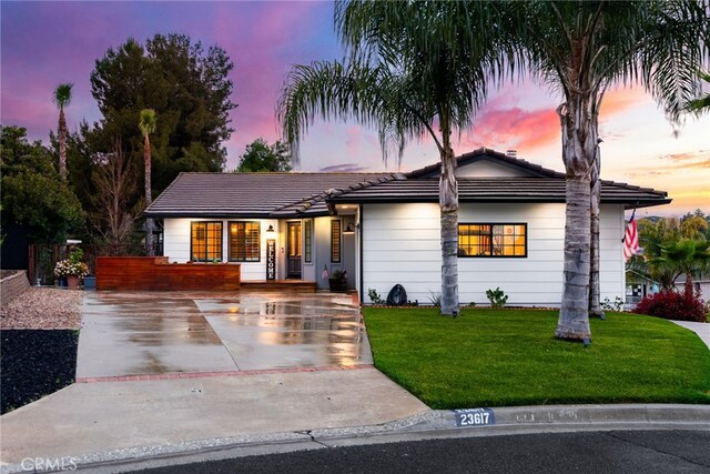 view of front of house with a yard