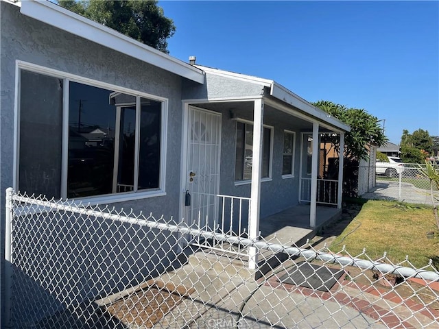 11619 Senwood St, Norwalk, CA 90650 - view of property exterior with stucco siding and a porch