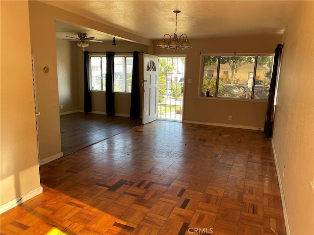 11619 Senwood St, Norwalk, CA 90650 - empty room featuring a chandelier, a textured ceiling, and a ceiling fan