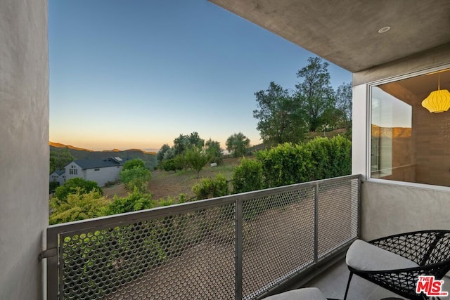 view of balcony at dusk