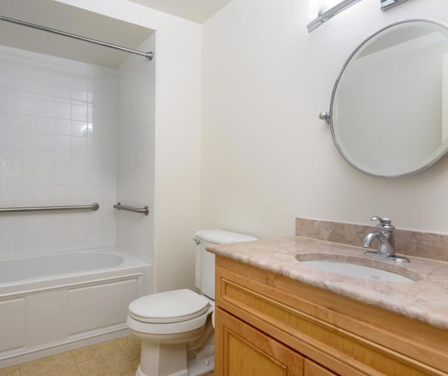 full bathroom featuring toilet, tile patterned flooring, tiled shower / bath, and vanity