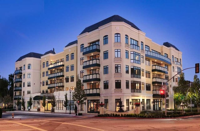 view of outdoor building at dusk