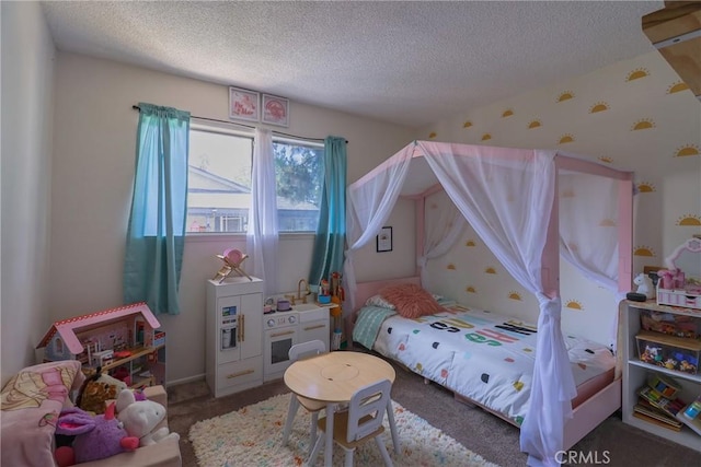 bedroom featuring carpet floors and a textured ceiling