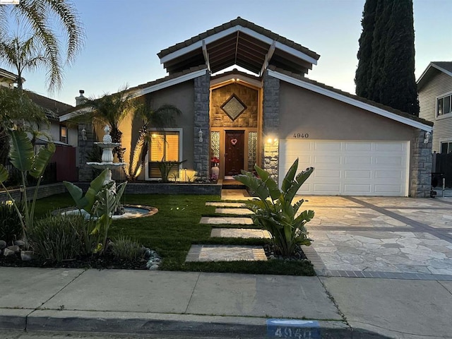 view of front facade featuring a garage and a front lawn