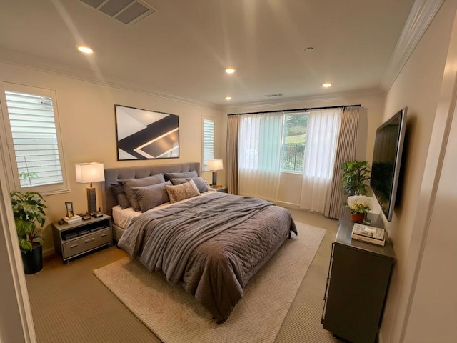 carpeted bedroom featuring crown molding