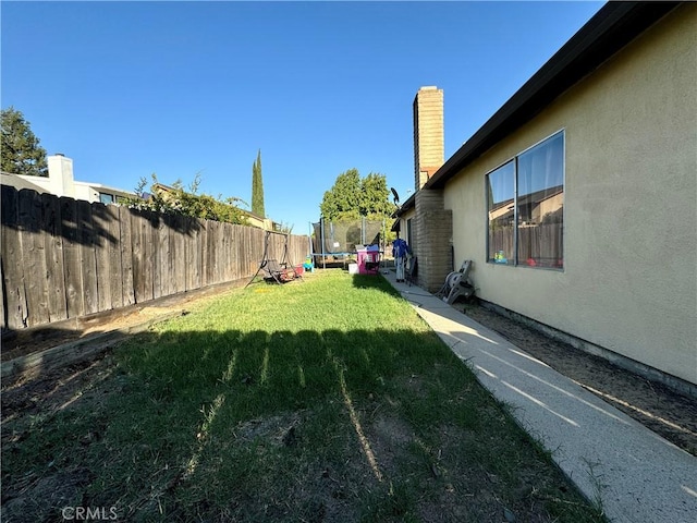 view of yard featuring a trampoline