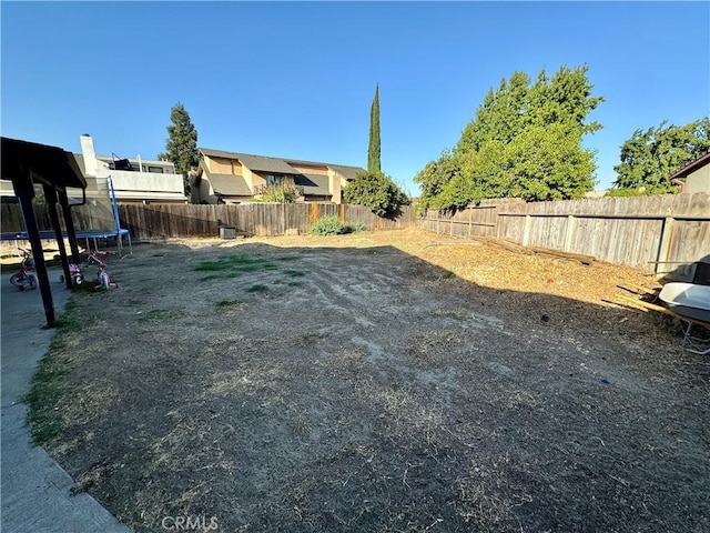 view of yard with a trampoline