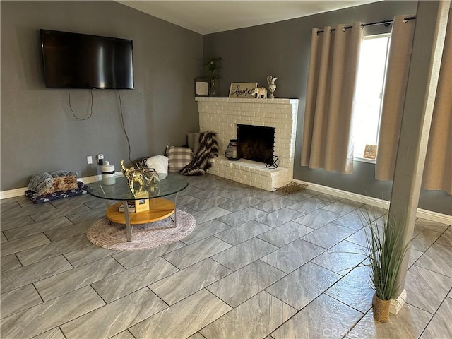 unfurnished living room with plenty of natural light and a brick fireplace