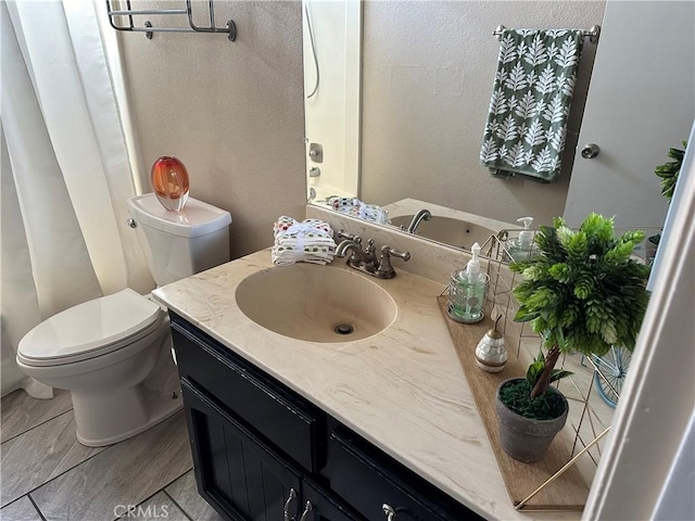 bathroom with vanity and toilet