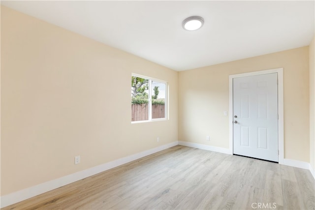 unfurnished room featuring light wood-type flooring