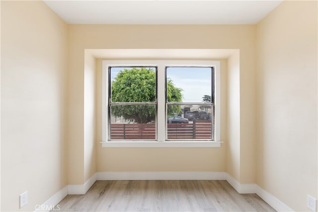 unfurnished room featuring light hardwood / wood-style floors