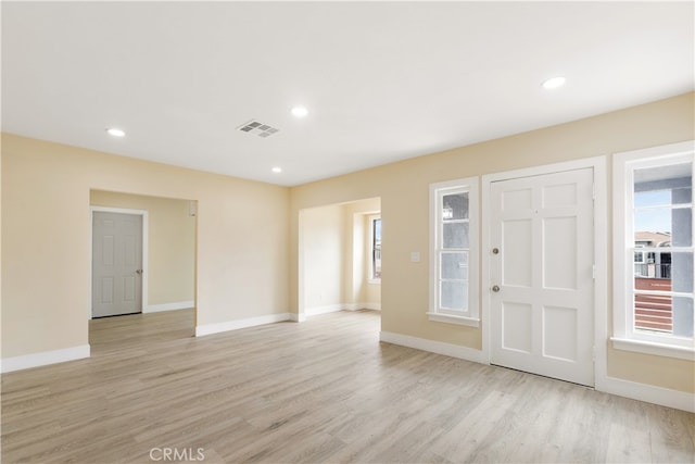 foyer entrance with light hardwood / wood-style floors