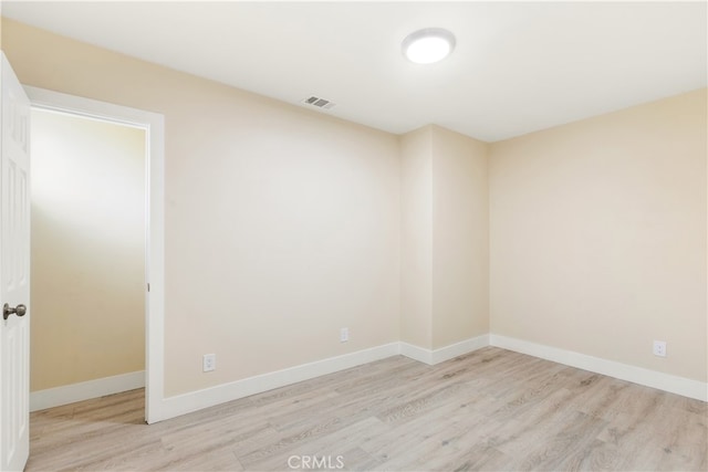 unfurnished room with light hardwood / wood-style flooring