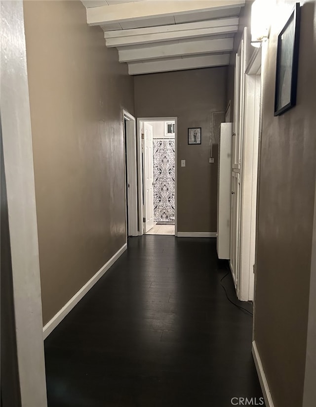 hallway with beamed ceiling and dark wood-type flooring