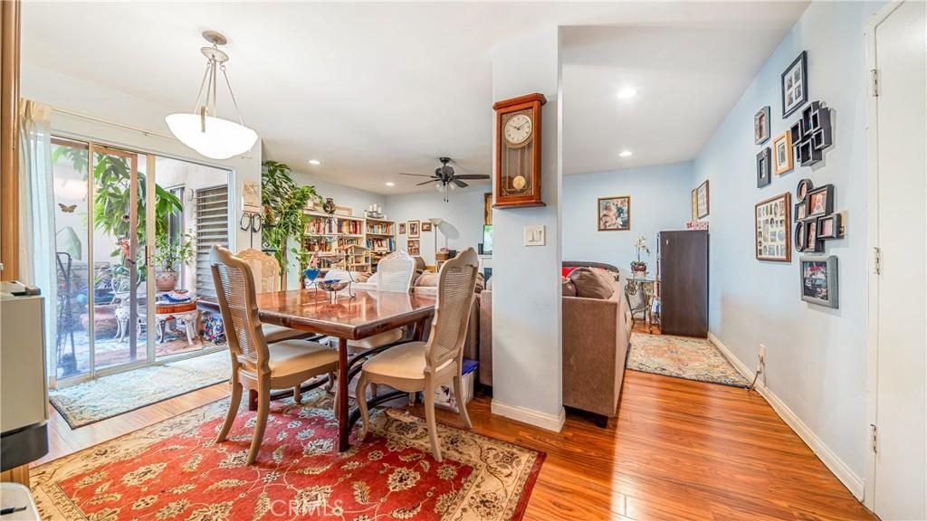 dining space featuring light hardwood / wood-style floors and ceiling fan