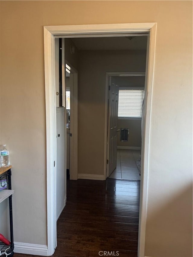 corridor with dark hardwood / wood-style floors