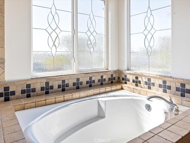 bathroom featuring a tub to relax in