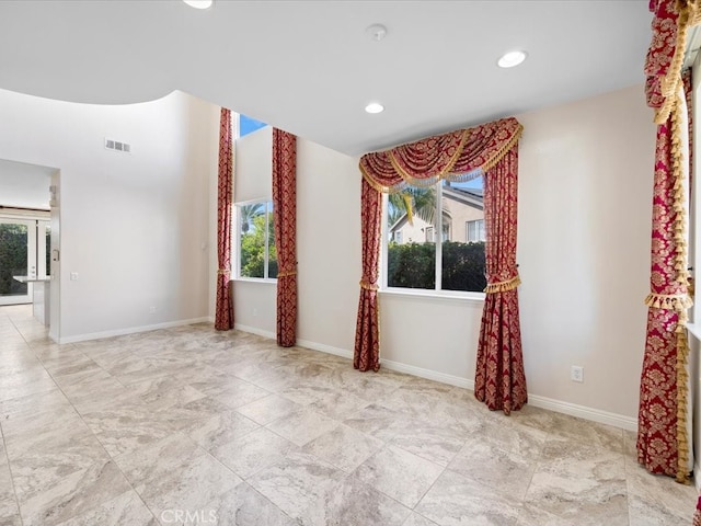 spare room featuring a wealth of natural light