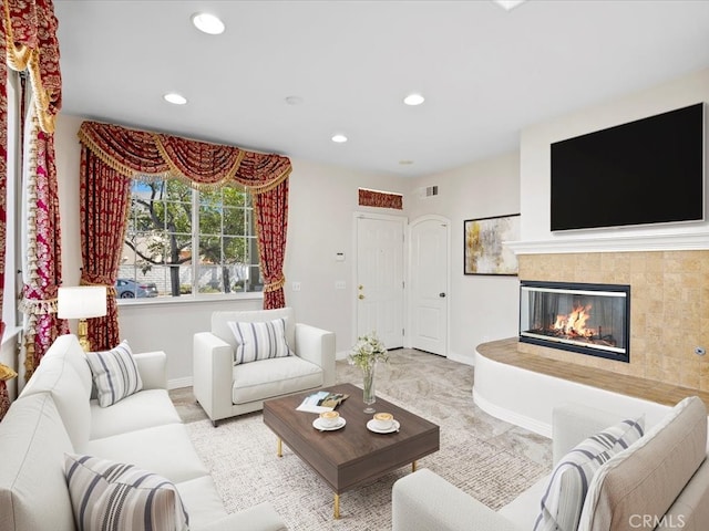 living room featuring a fireplace