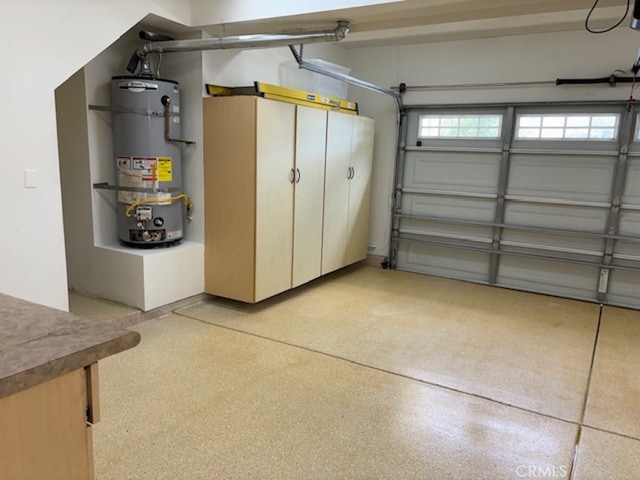 garage featuring strapped water heater