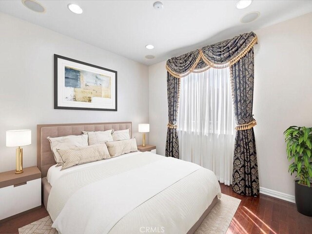 bedroom featuring dark hardwood / wood-style flooring