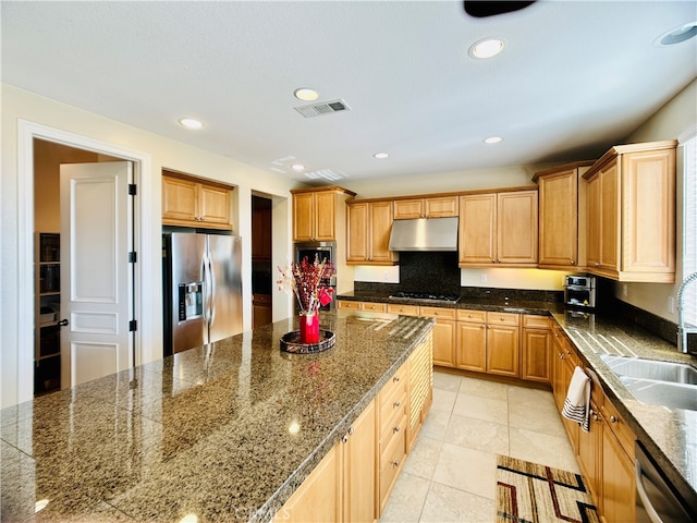 kitchen featuring light tile patterned flooring, sink, and stainless steel appliances