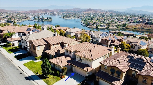 bird's eye view featuring a water and mountain view